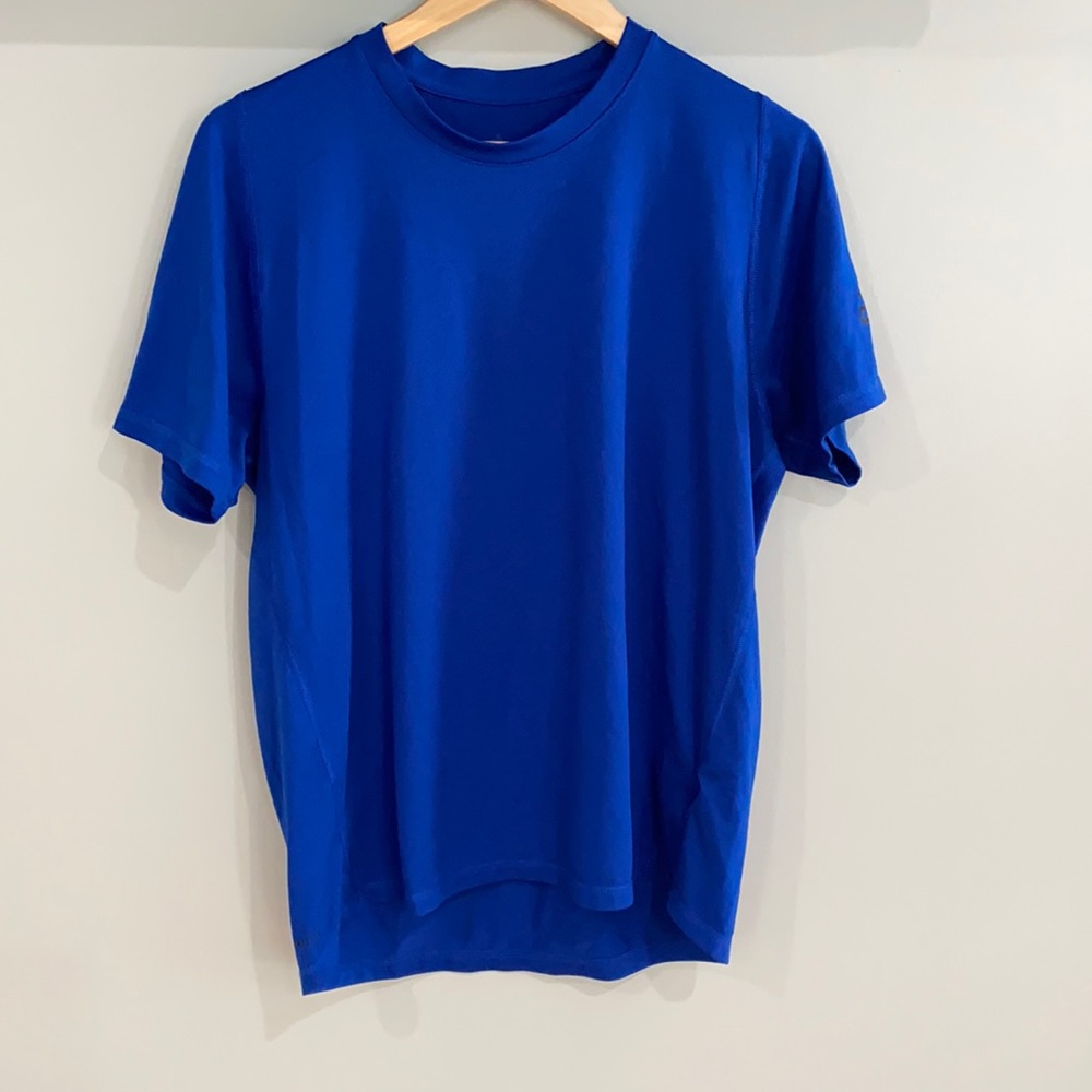 Men’s Adidas shirt in a size medium.